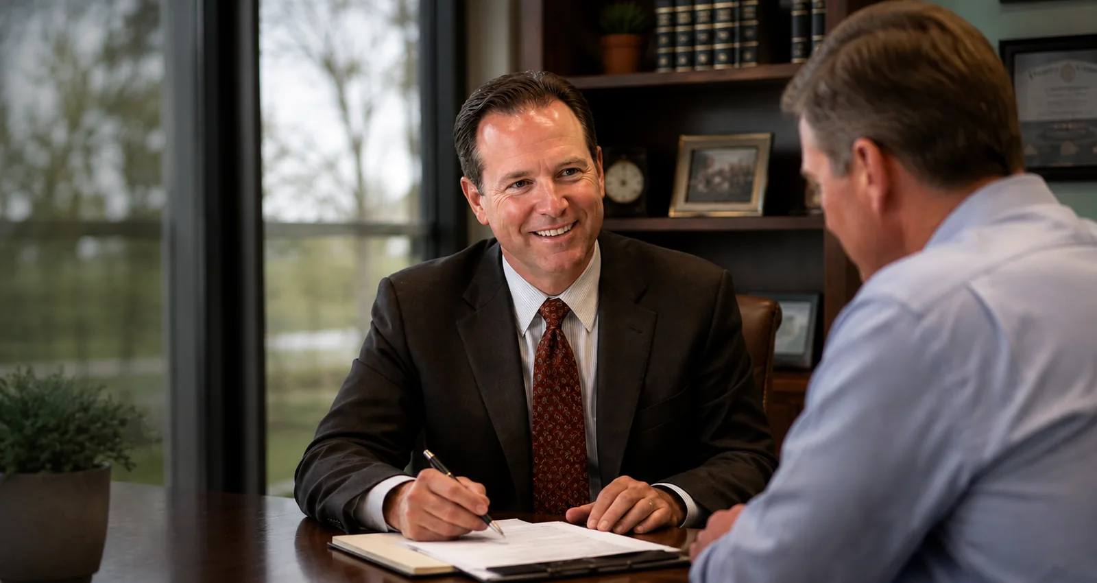 Advisor meeting with a property owner to review tax planning documents